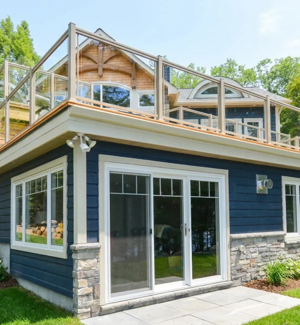 Glass railings on a Columbus deck providing wind protection.